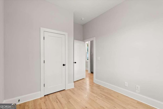 unfurnished bedroom featuring light wood-type flooring