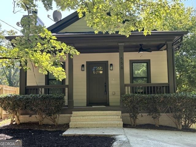 view of front of property with ceiling fan and covered porch