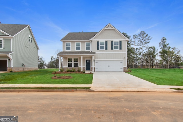 craftsman inspired home with a front yard and a garage