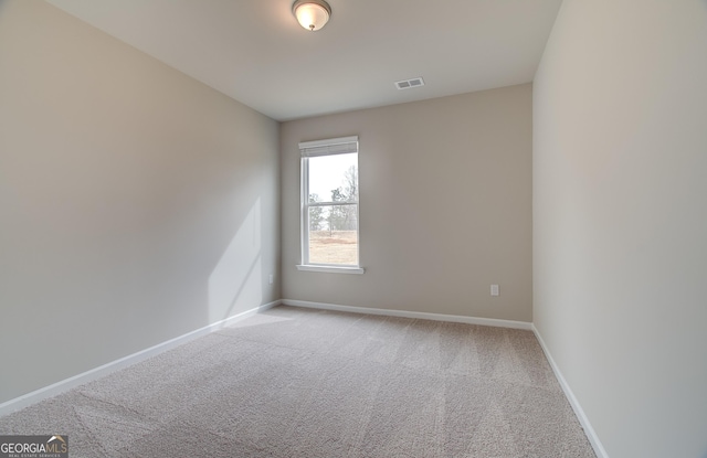 view of carpeted spare room