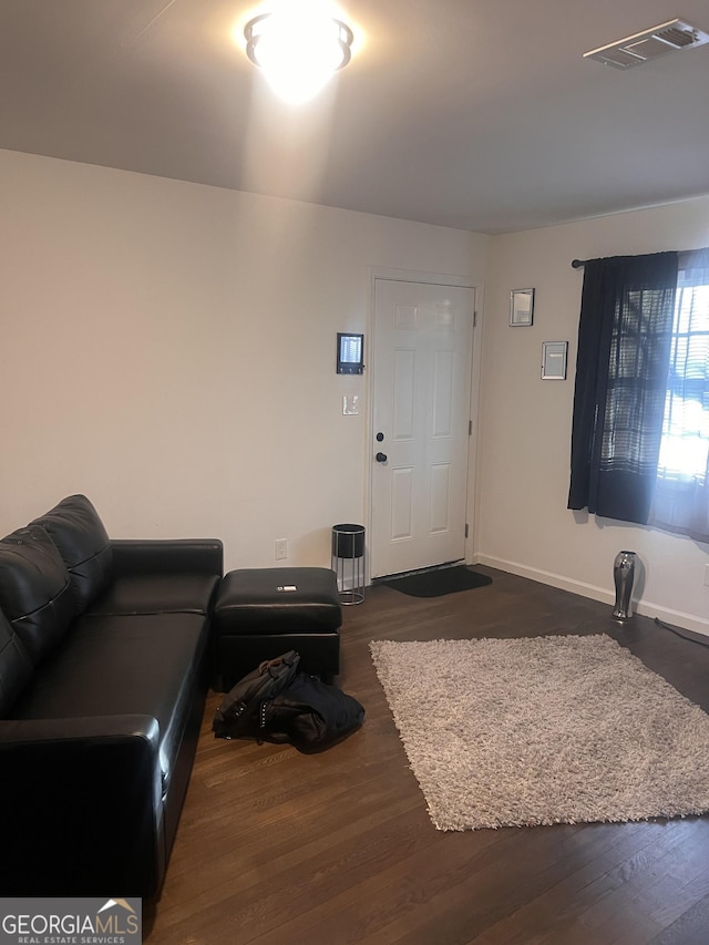 living room featuring dark hardwood / wood-style flooring