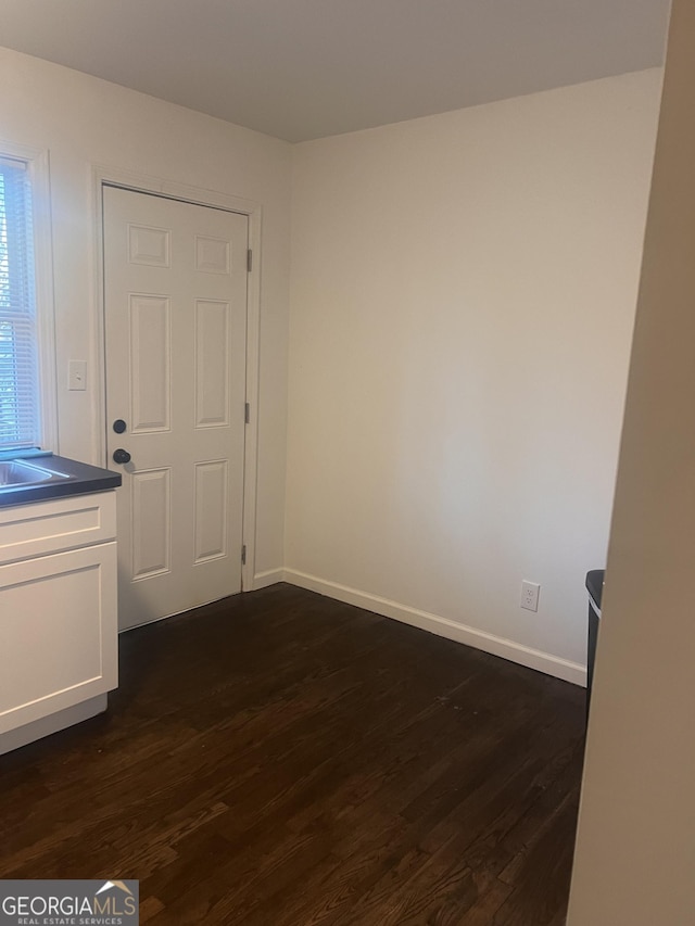 spare room featuring dark hardwood / wood-style floors