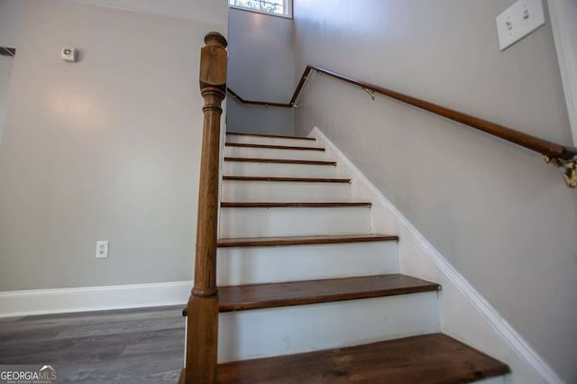 stairs with hardwood / wood-style floors