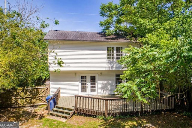 back of property featuring french doors and a deck