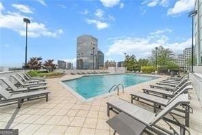 view of swimming pool with a patio