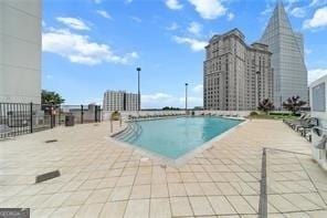 view of swimming pool featuring a patio