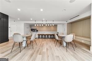 dining space featuring light wood-type flooring