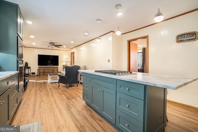 kitchen with ceiling fan, stainless steel appliances, light wood-style floors, open floor plan, and crown molding