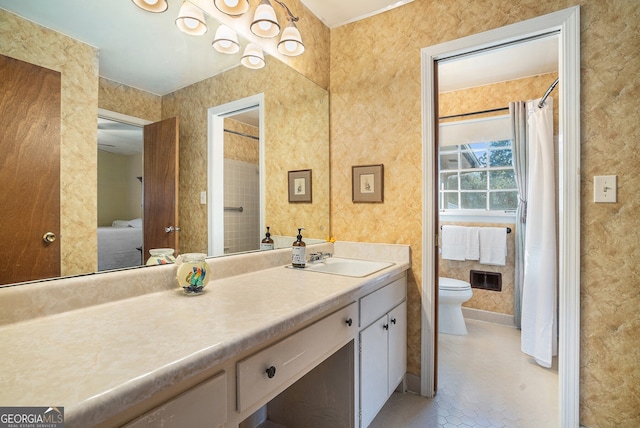 ensuite bathroom with visible vents, toilet, ensuite bath, tile patterned floors, and vanity