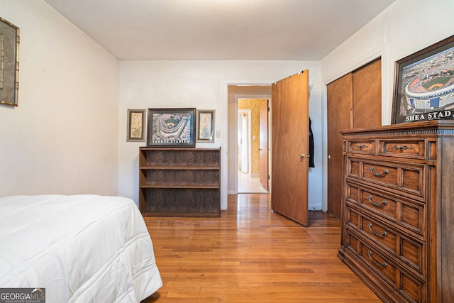 bedroom featuring wood finished floors