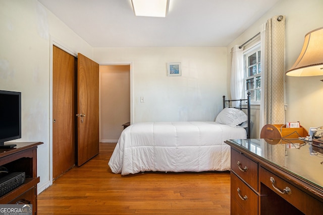 bedroom with wood finished floors