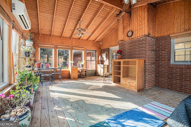 unfurnished sunroom featuring a wall unit AC, vaulted ceiling with beams, ceiling fan, and wooden ceiling