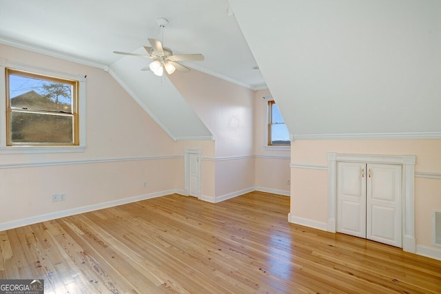 additional living space featuring ceiling fan, lofted ceiling, and light hardwood / wood-style flooring