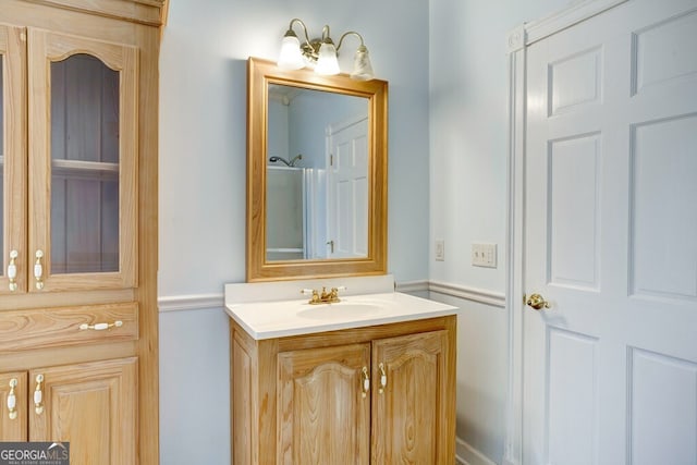 bathroom featuring vanity and a shower