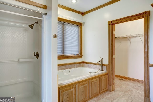 bathroom with a bathtub and crown molding