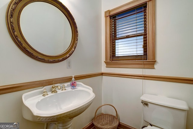 bathroom featuring sink and toilet