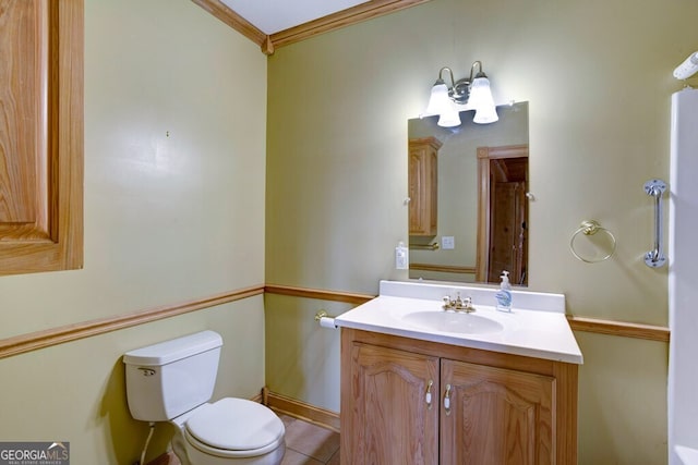 bathroom featuring crown molding, tile patterned flooring, vanity, and toilet