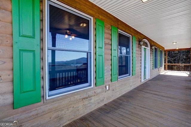 wooden deck featuring covered porch