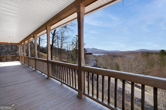 wooden deck featuring a mountain view