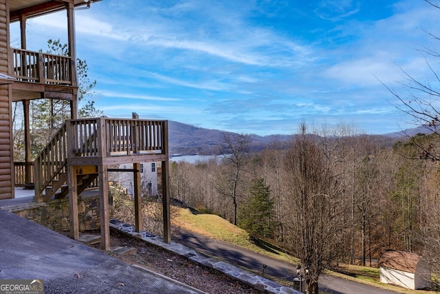 exterior space with a deck with mountain view