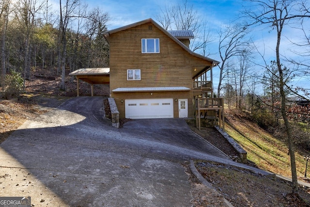 view of side of property featuring a garage