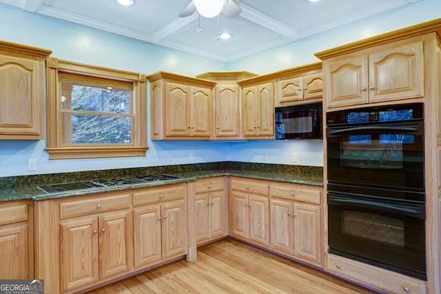 kitchen featuring light brown cabinetry, dark stone counters, ceiling fan, black appliances, and light hardwood / wood-style floors