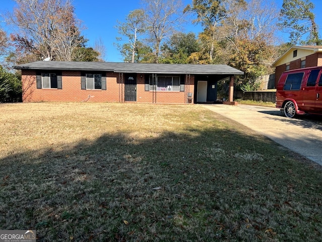 single story home with a front lawn and a carport