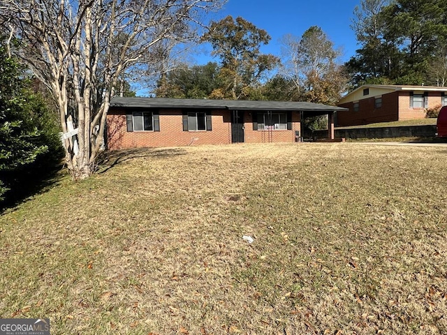 single story home featuring a front yard