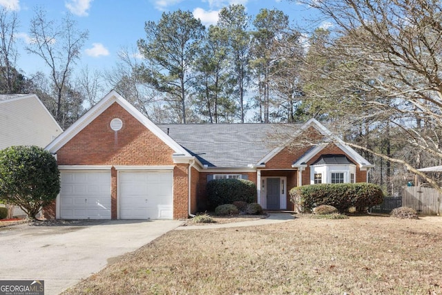 view of front of home with a front yard and a garage