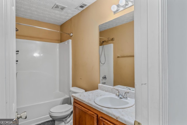 full bathroom with vanity, a textured ceiling, bathing tub / shower combination, and toilet