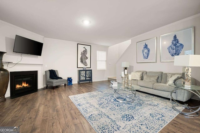 living room with hardwood / wood-style floors and crown molding