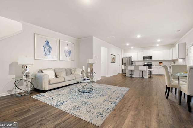 living room with crown molding and dark wood-type flooring