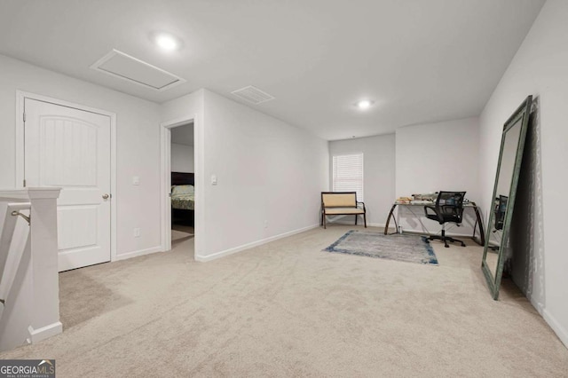 exercise room with light carpet