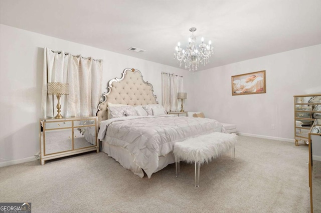 carpeted bedroom featuring a notable chandelier