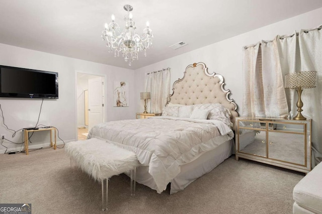 bedroom with carpet and a chandelier