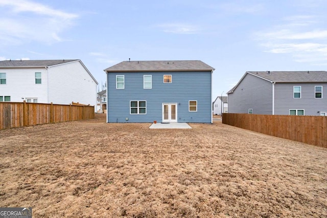 rear view of property featuring a patio area