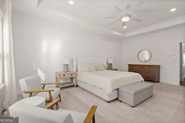 bedroom featuring light carpet, a raised ceiling, ceiling fan, and crown molding