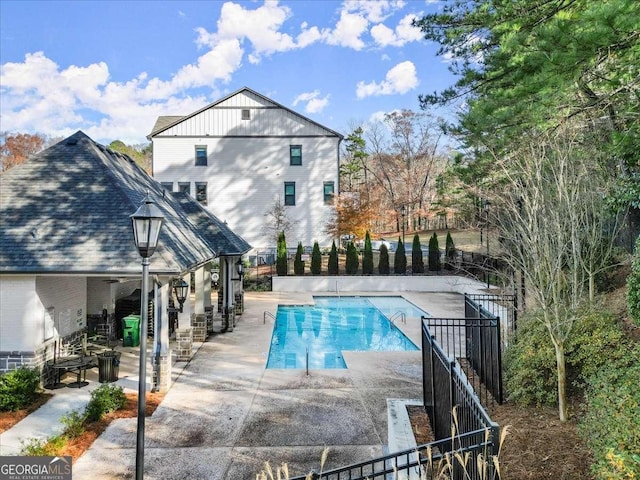 view of swimming pool with a patio area