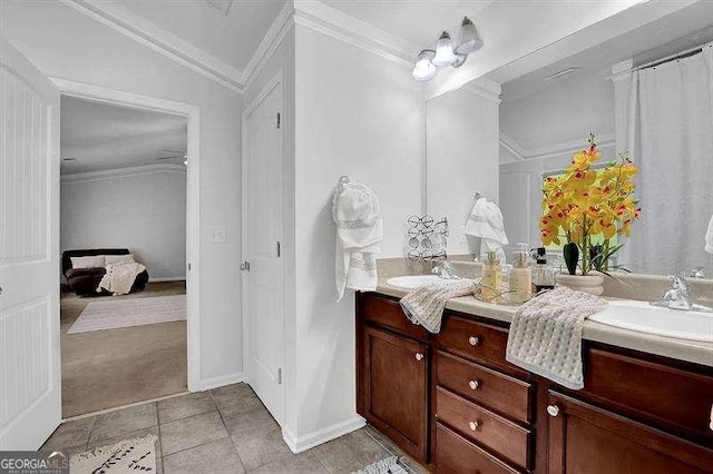 bathroom with tile patterned flooring, vanity, vaulted ceiling, and ornamental molding