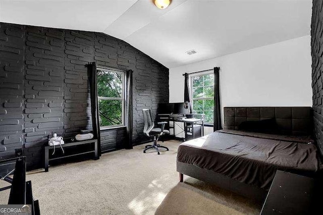 bedroom featuring light colored carpet, lofted ceiling, and pool table