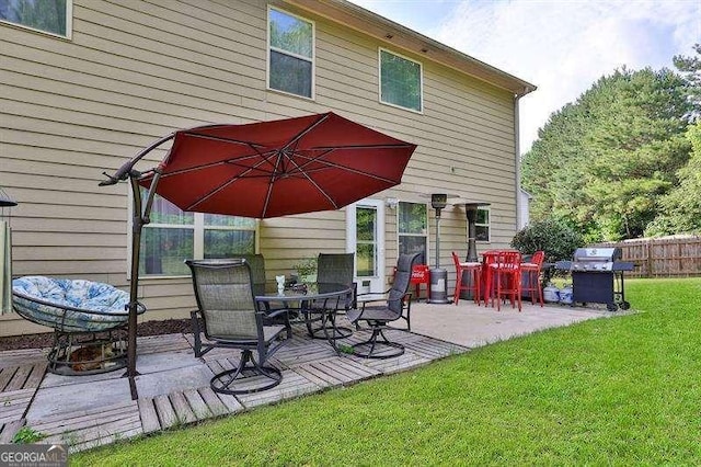 rear view of property featuring a yard and a patio