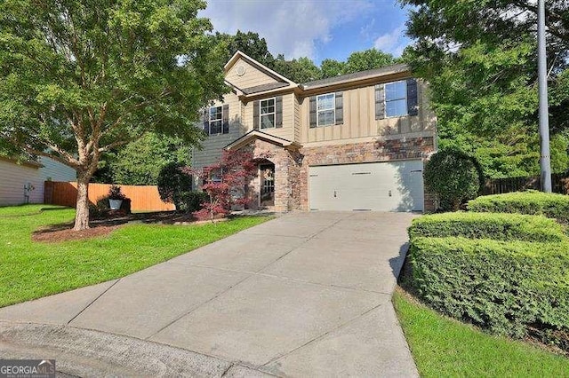 view of front of house with a front yard and a garage