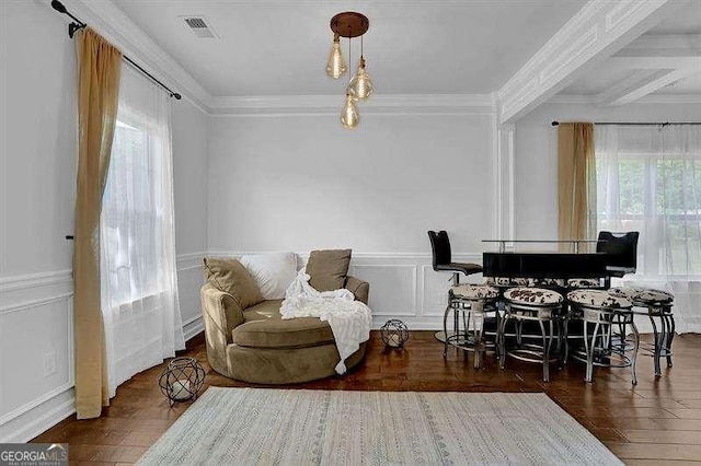 sitting room featuring plenty of natural light, dark hardwood / wood-style flooring, and ornamental molding