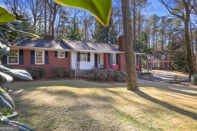 ranch-style house with a front lawn