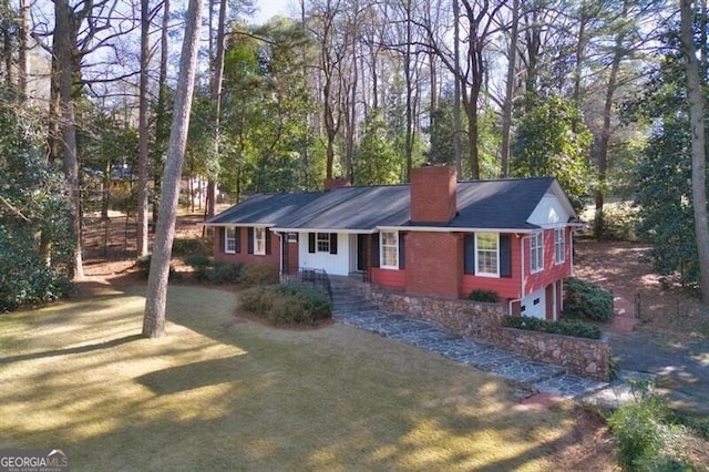 ranch-style house with a front lawn