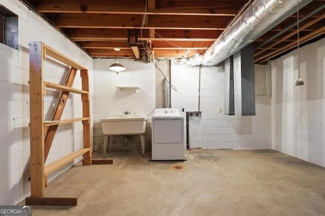 basement featuring washer / clothes dryer and sink