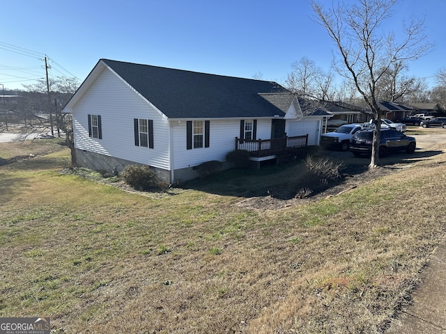 view of side of property featuring a yard