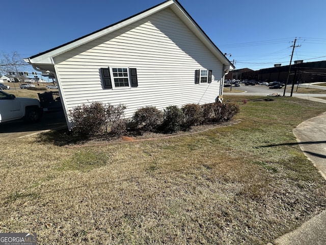 view of home's exterior featuring a yard