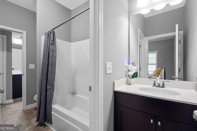 full bathroom with shower / bath combination with curtain, vanity, and toilet