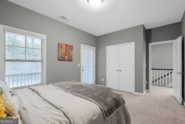 carpeted bedroom featuring a closet